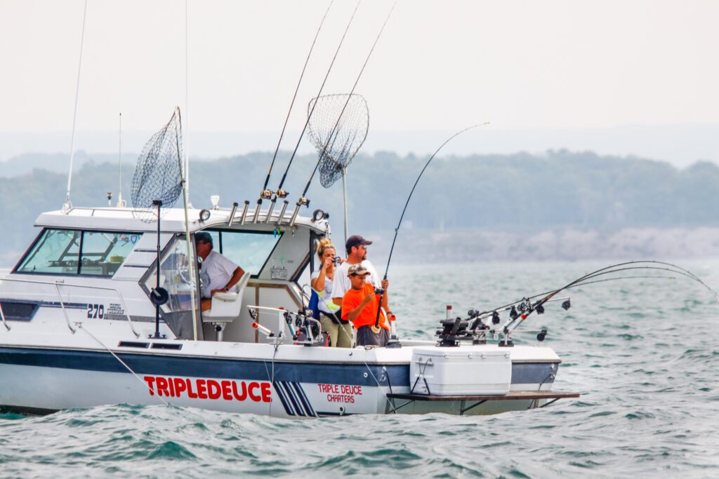 family fishing on a boat on lake Ontario