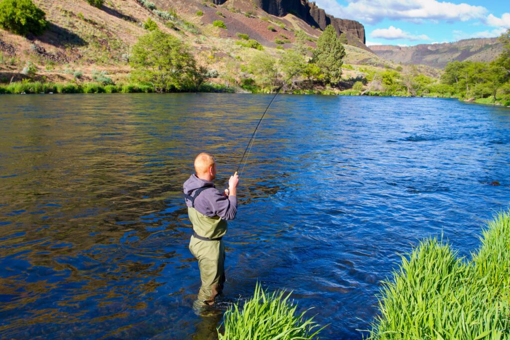 man wearing fly fishing waders