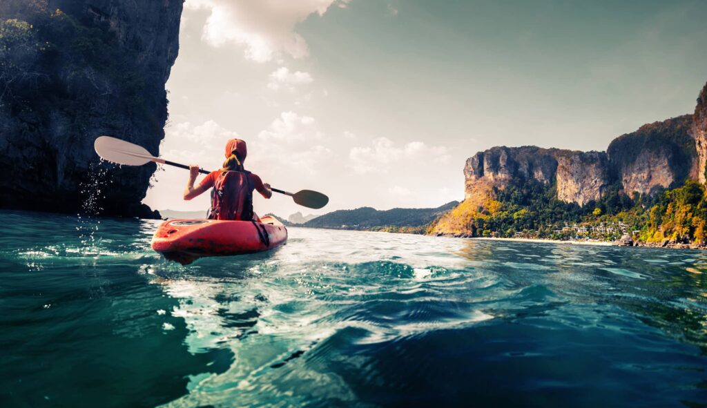 woman fishing on kayak